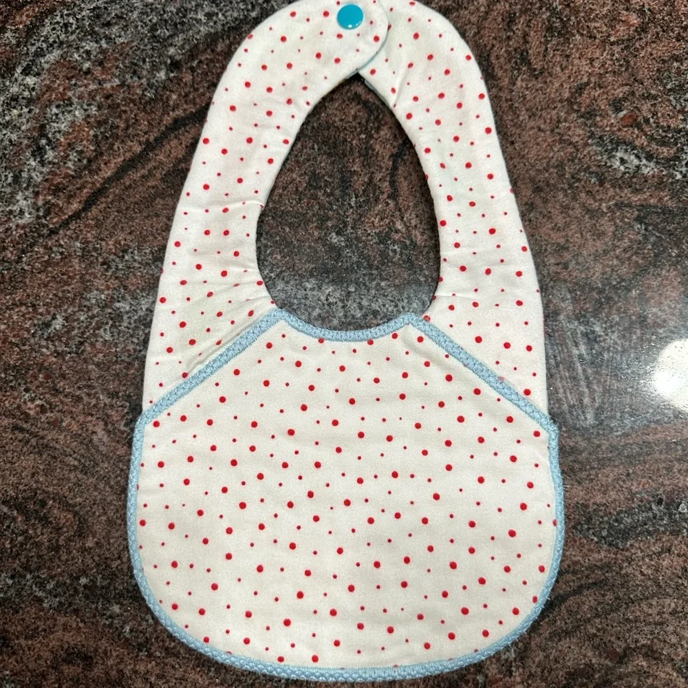 Handmade reversible quilted baby bib with train design
